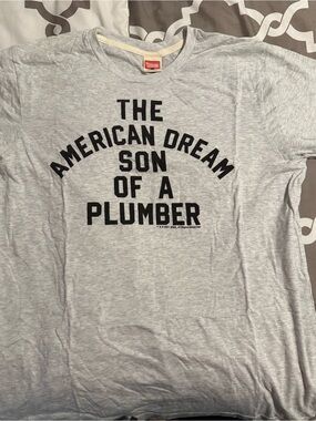 WWE Homage Dusty Rhodes Graphic Tee "The American Dream Son of a Plumber" Tshirt
